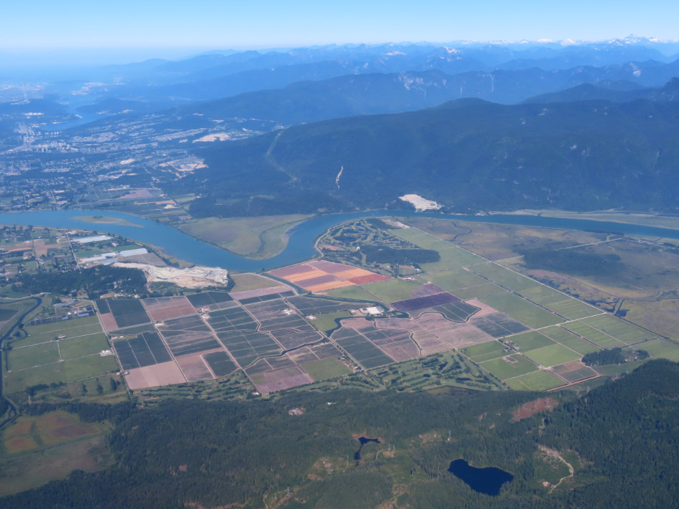 An aerial view of the Pitt River entering the Fraser Valley, about 35 km by air from the Vancouver airport.