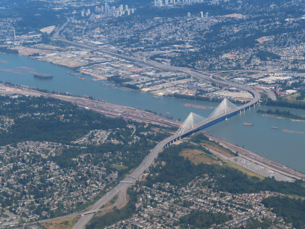 An aerial view of the Port Mann Bridge, Fraser River, and area.