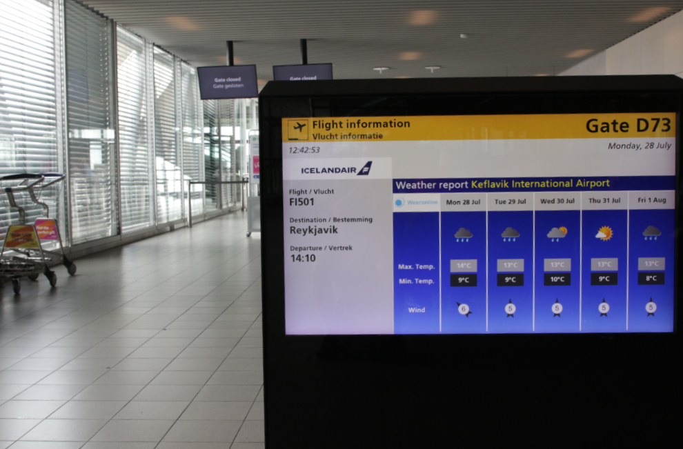 Flight information screen at Gate D73, Amsterdam Airport Schiphol (AMS).