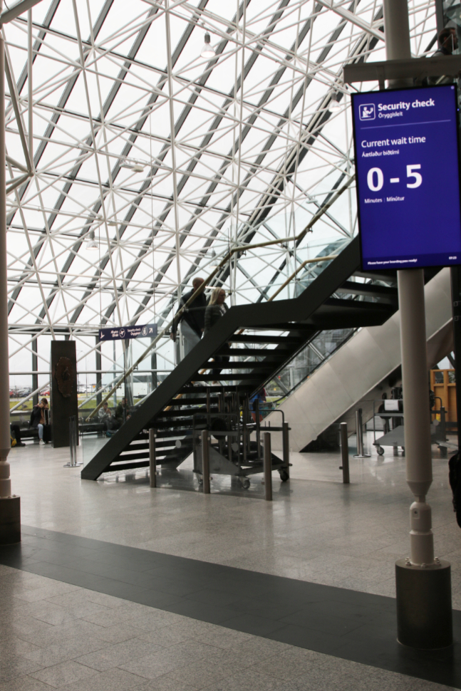 Walking to the security check area at Reykjavík–Keflavík Airport (KEF).