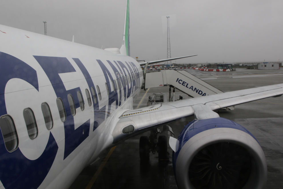 Boarding an aircraft on the ramp at rainy Reykjavík–Keflavík Airport (KEF).