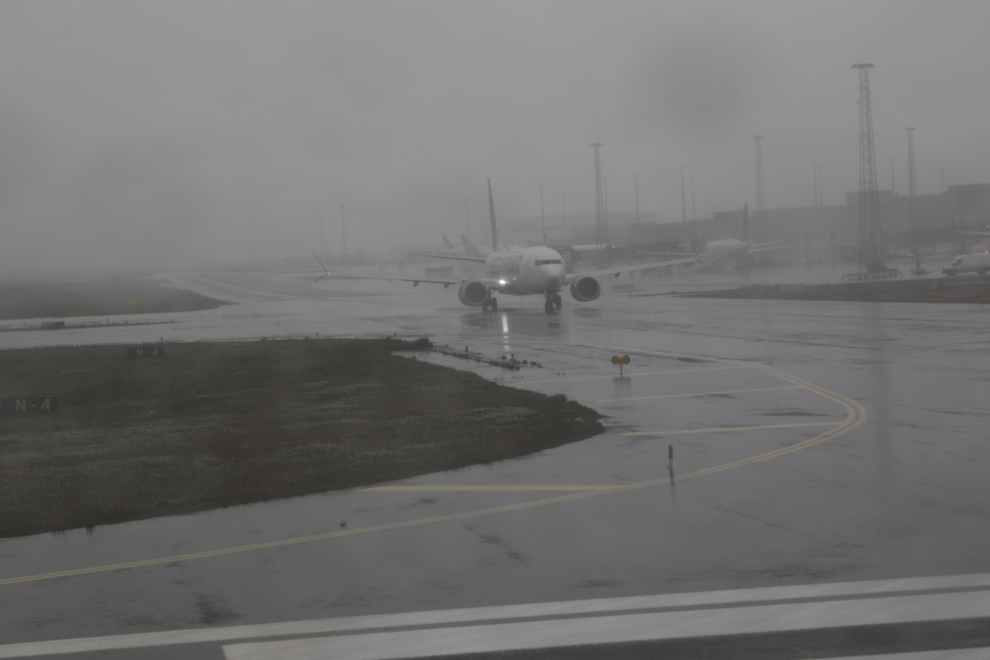 Taxiiing at rainy Reykjavík–Keflavík Airport (KEF).