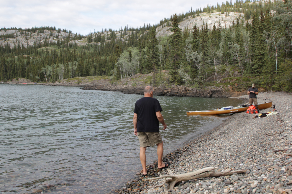 Canoeing along Lake Laberge, Yukon.
