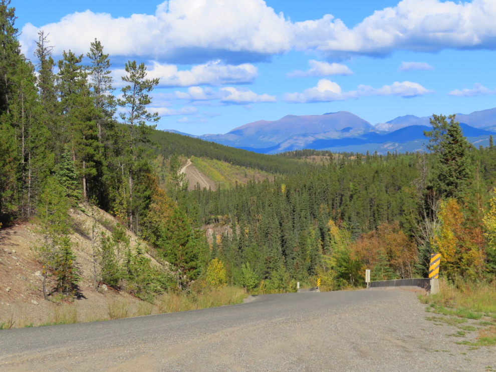 Fish Lake Road drops steeply down into the valley of McIntyre Creek, where it meets the Alaska Highway.