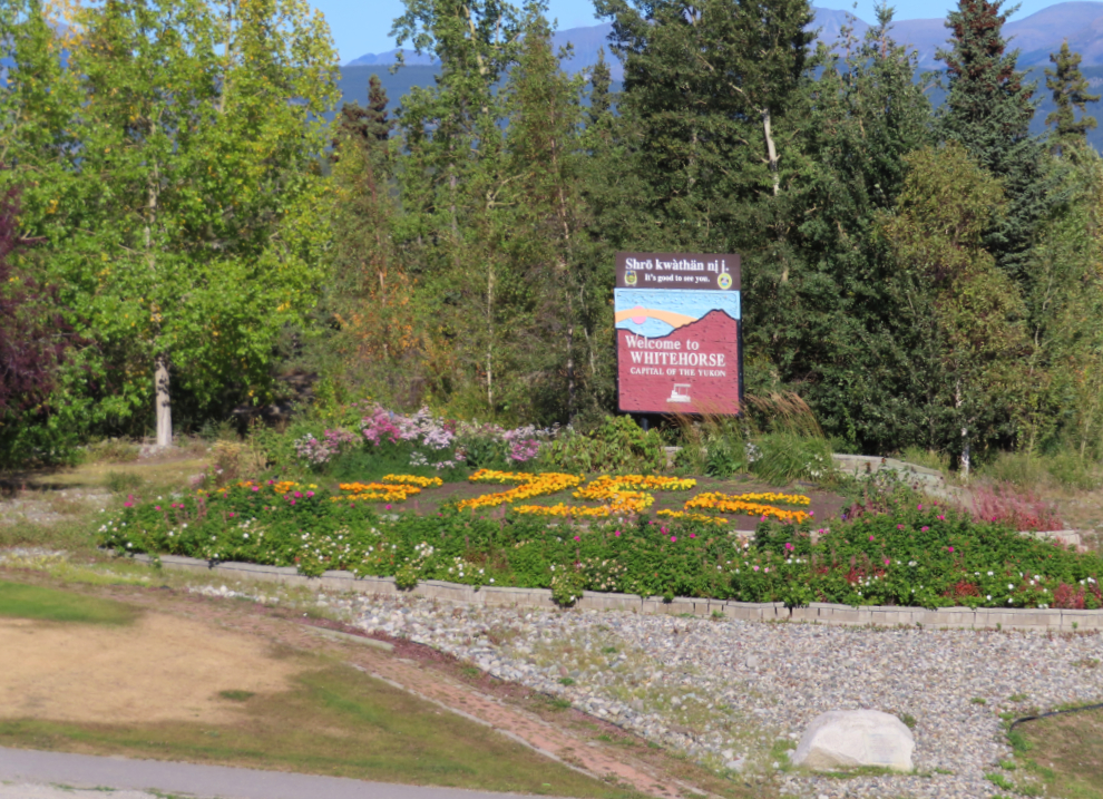The 75th Anniversary garden at the Welcome to Whitehorse sign.