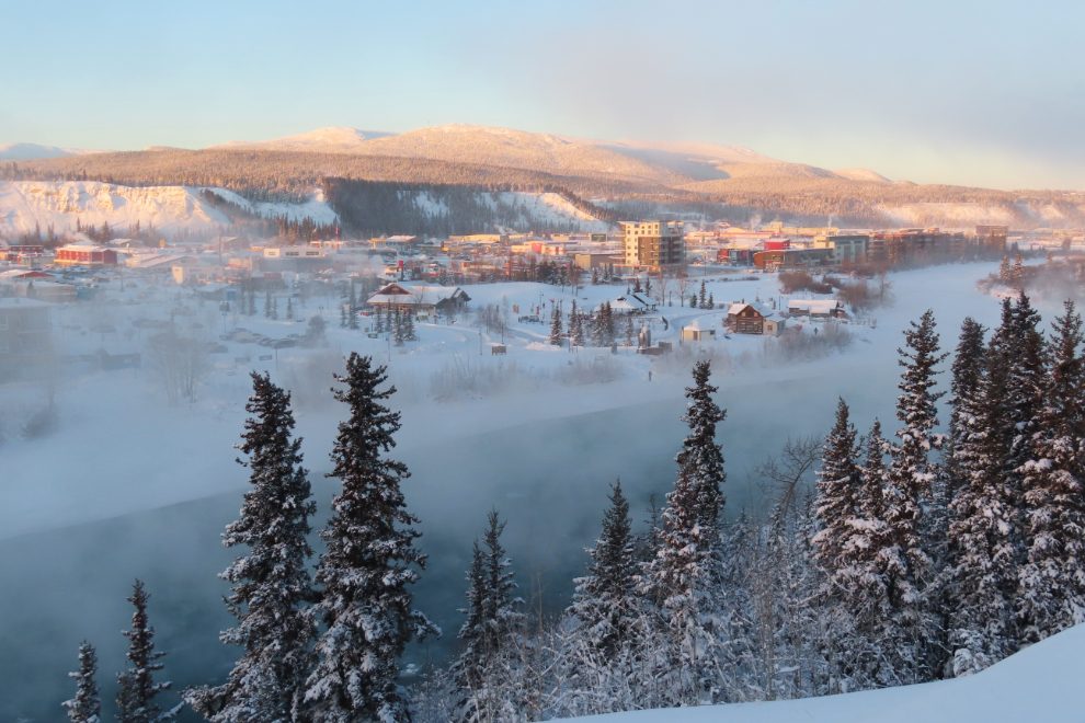 Looking over the steaming Yukon River to Shipyards Park at Whitehorse, Yukon, with the temperature at 28 degrees below zero.