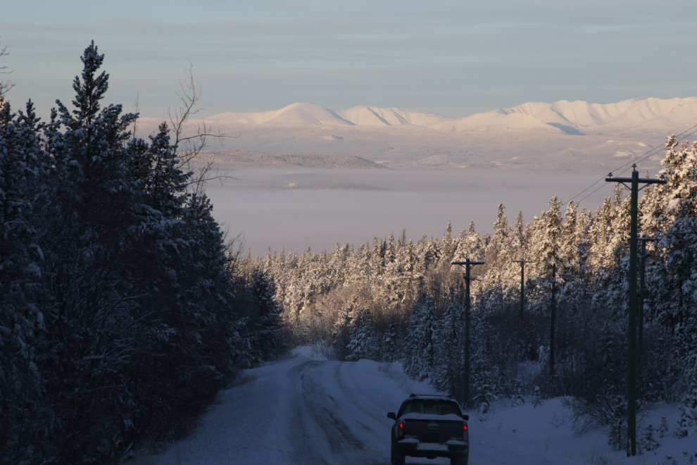 Driving down Grey Mountain Road at Whitehorse, Yukon, with the valley full of ice fog at 41 degrees below zero.