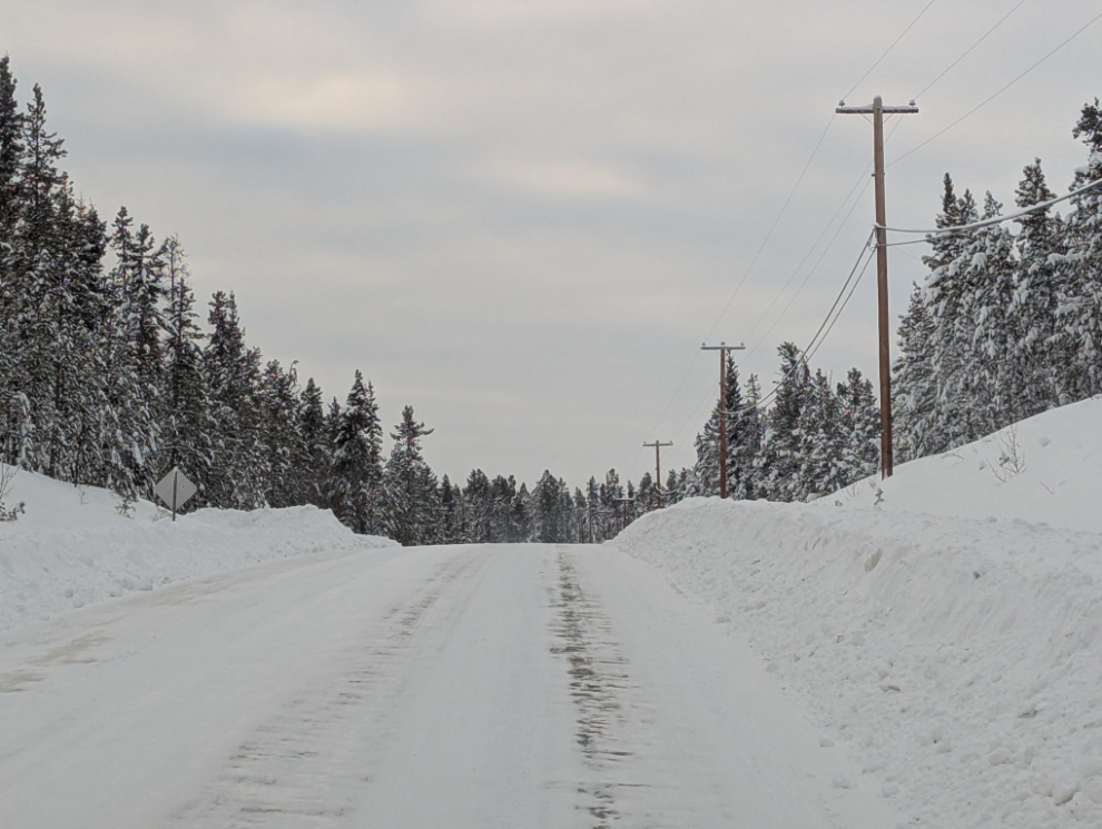 Fireweed Drive at Mary Lake, cut through deep snow.