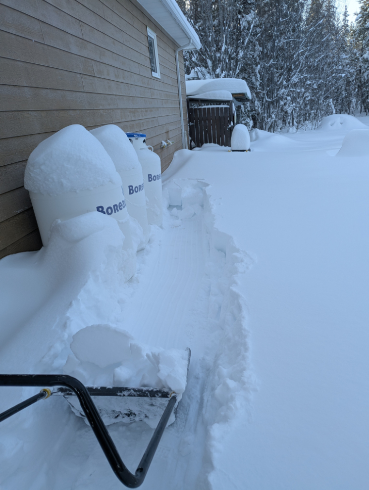 Cutting a path through deep snow to our propane tanks.