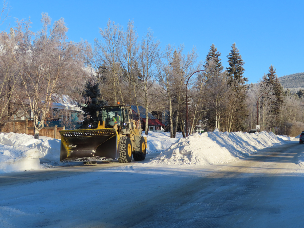 The snow berm inn the middle of of Alsek Road during clearing.