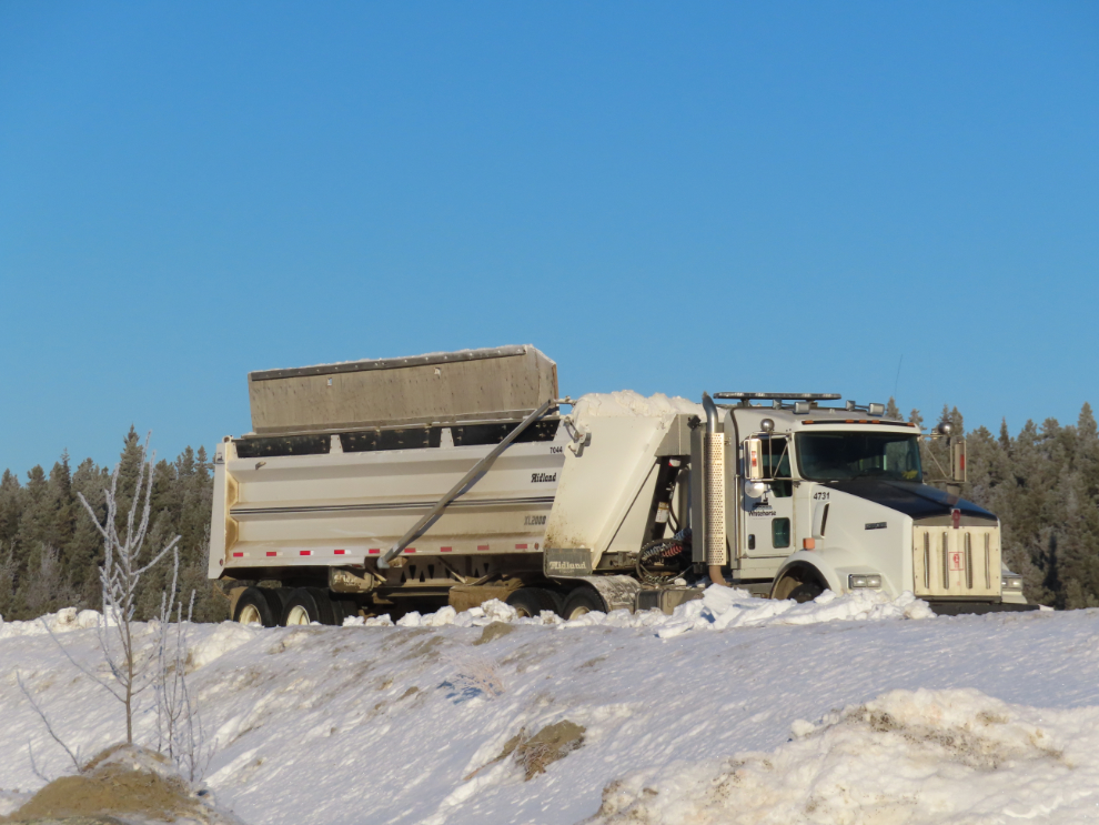 A large dump truck at one of the snow dumps in Whitehorse.