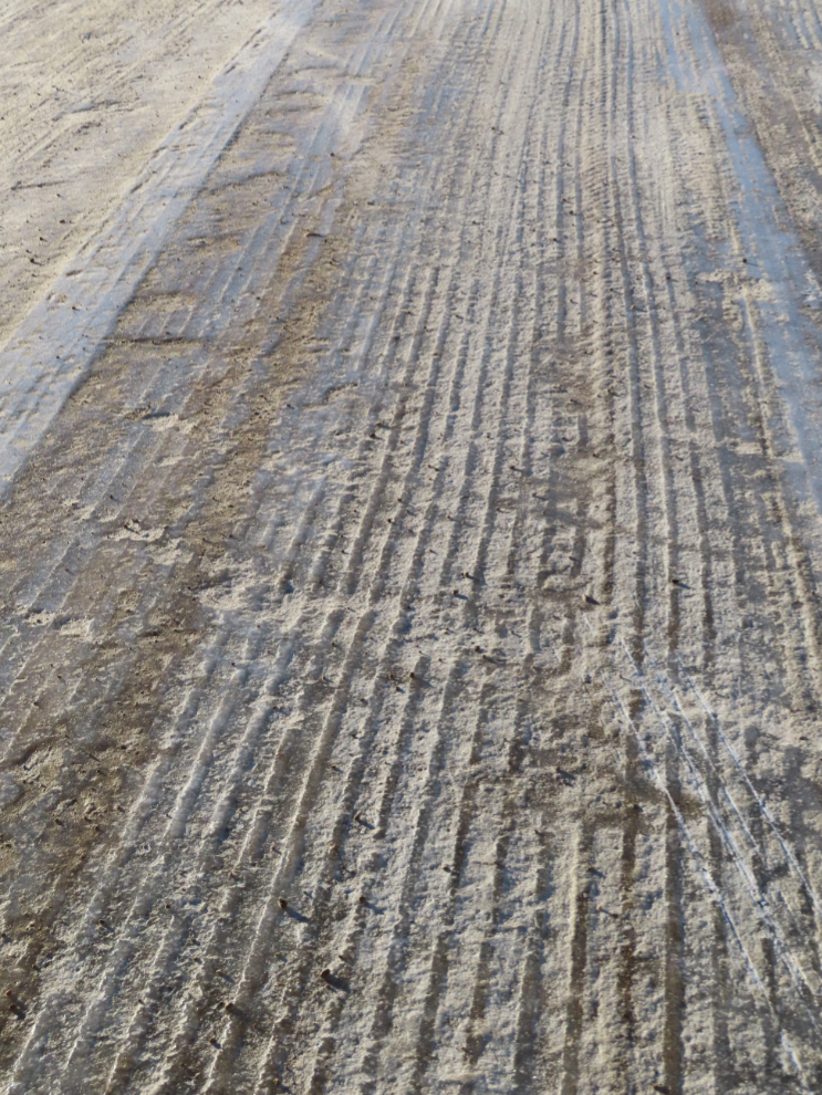 Ice on the South Klondike Highway gouged  by spcial blades on graders.