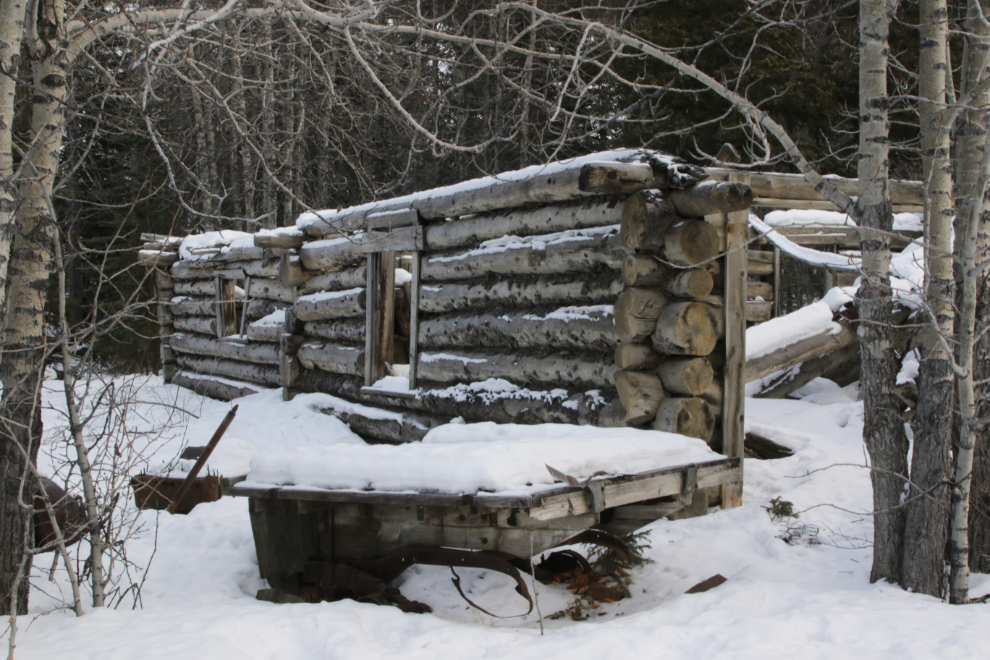 Log cabin ruins at the ghost town  of Kluane (Silver City), Yukon, in February