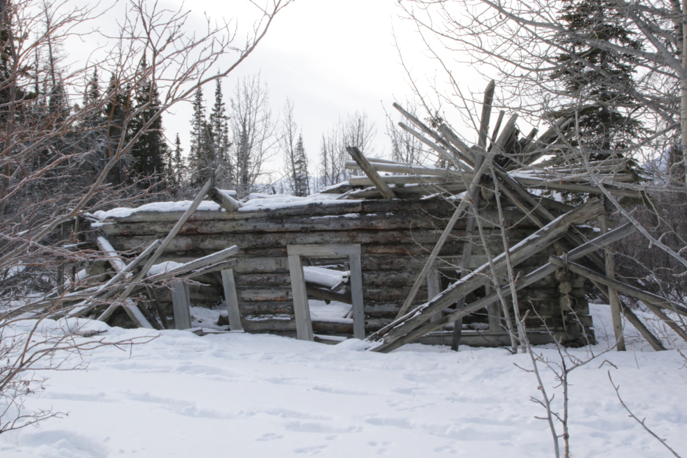 Log cabin ruins at the ghost town  of Kluane (Silver City), Yukon, in February