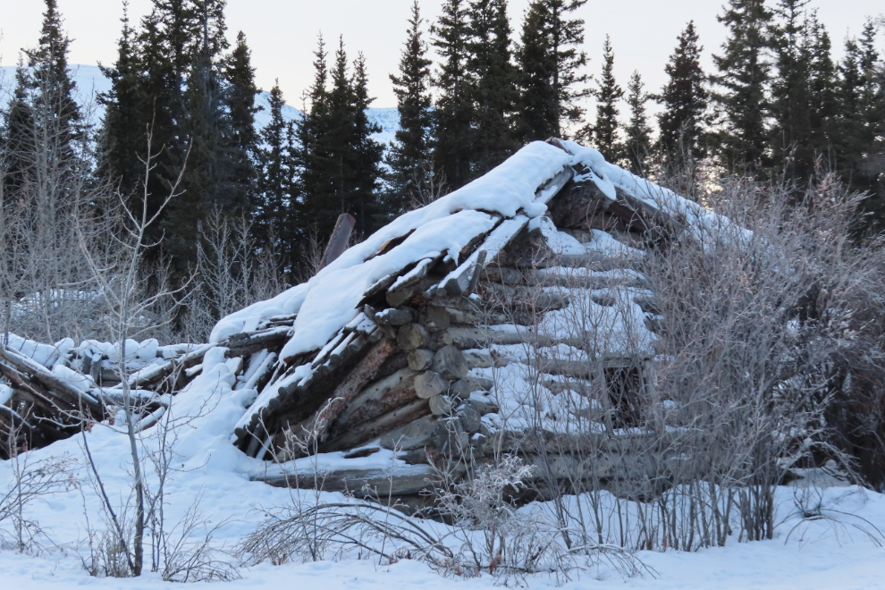 Log cabin ruins at the ghost town  of Kluane (Silver City), Yukon, in February