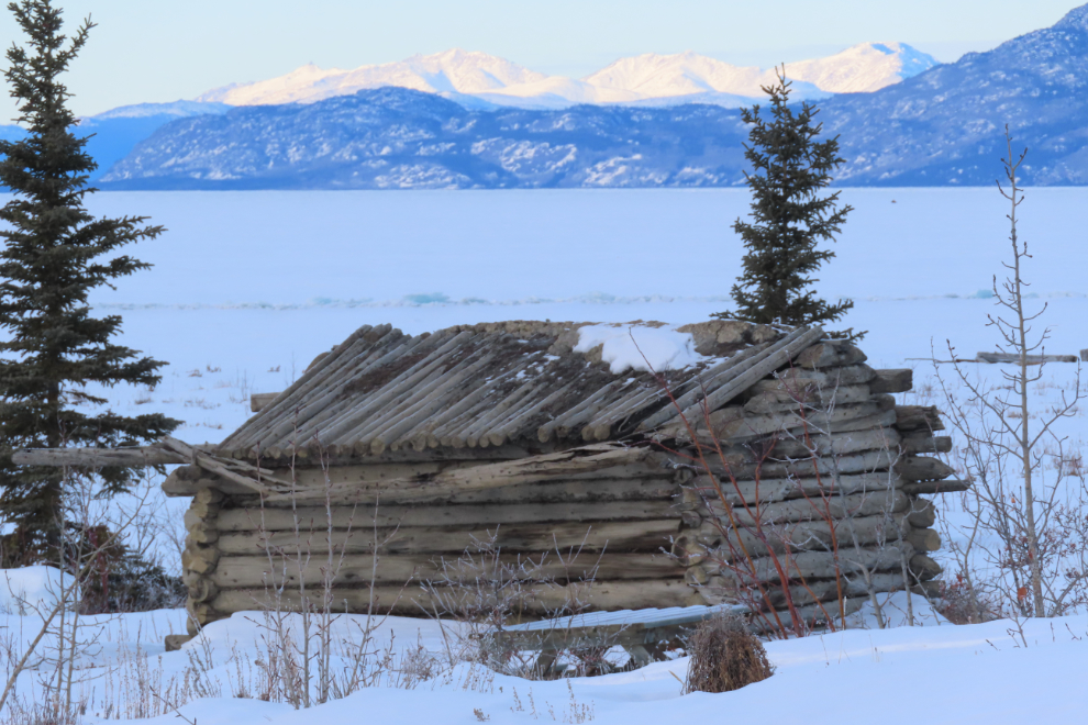 Log cabin ruins at the ghost town  of Kluane (Silver City), Yukon, in February