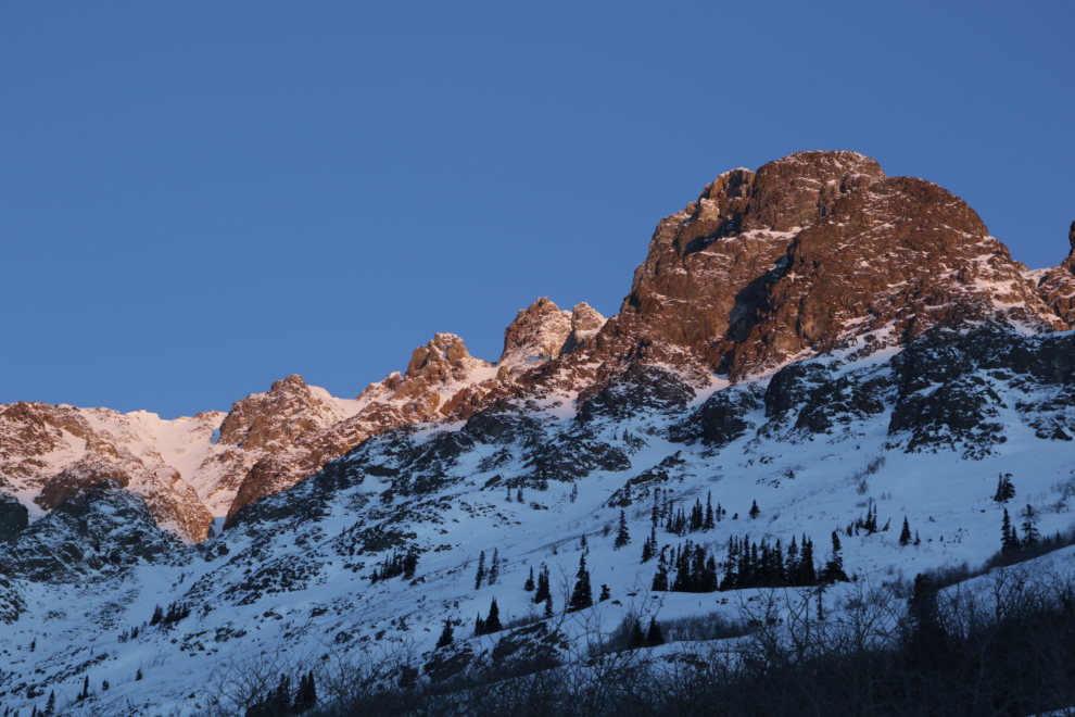 The first light of the day hits Dail Peak in late March.