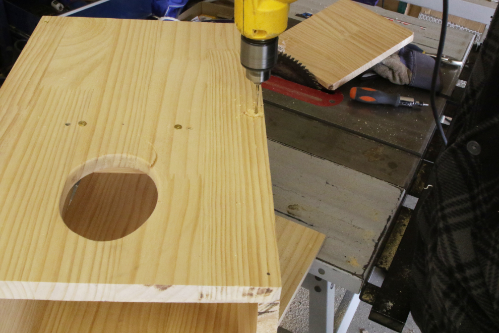 Building a boreal owl nesting box.