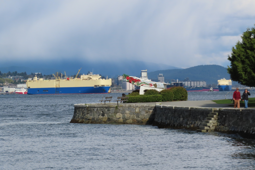 At Vancouver, the car carrier Dream Dina beyond the replica of the figurehead from the S.S. Empress of Japan.