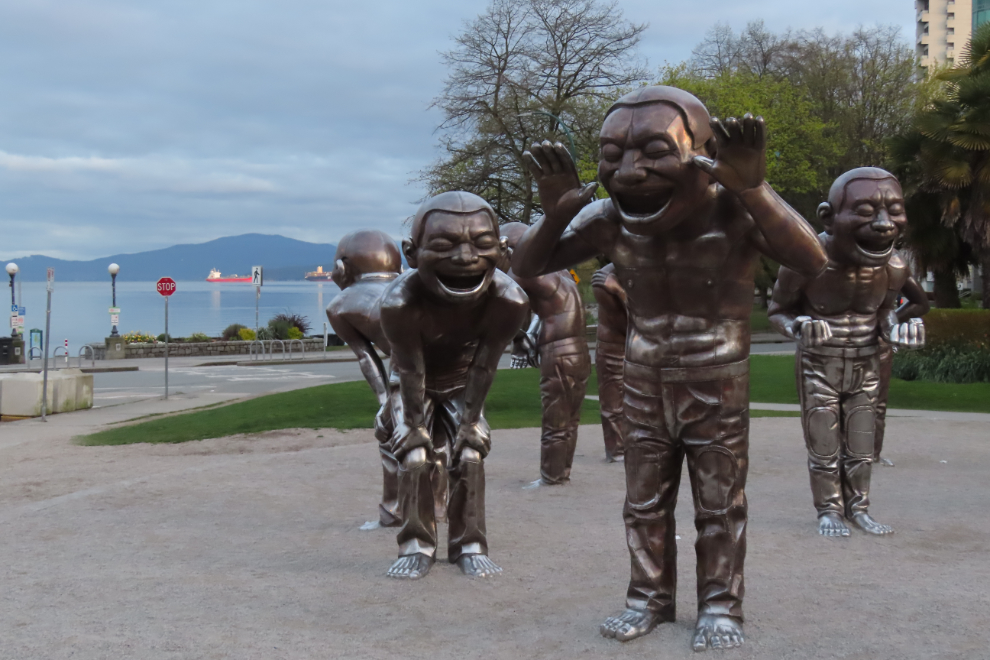 'A-maze-ing Laughter' is a set of 14 bronze statues created by Beijing-based artist Yue Minjun, installed at Vancouver.