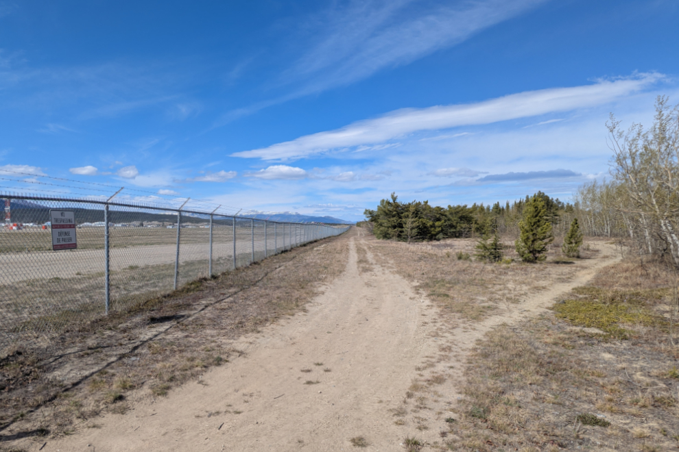 The airport perimeter road and one of the trails leading off it at the south end of the Whitehorse airport.