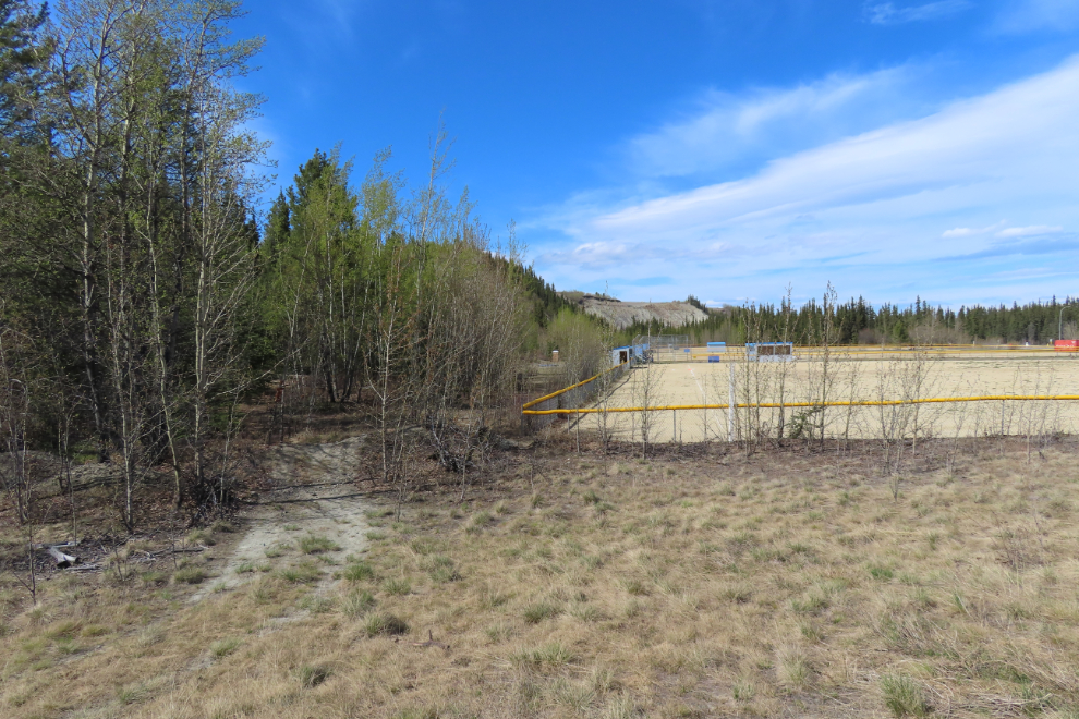 The start of the trail  that climbs he escarpment at the south end of the Whitehorse airport.
