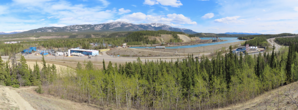 A panorama of Yukon Energy's facilities, from the offices and control centre on the left to the diesel generation plant, the hydro dam, and the LNG generation plant. 