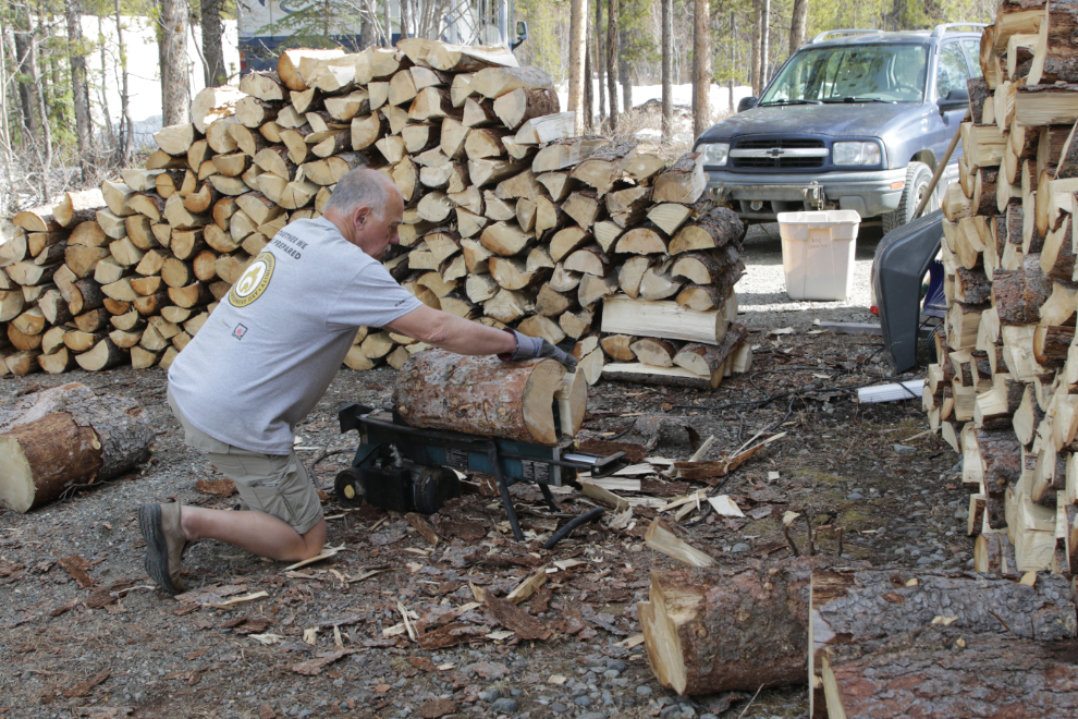 Splitting and stacking firewood.