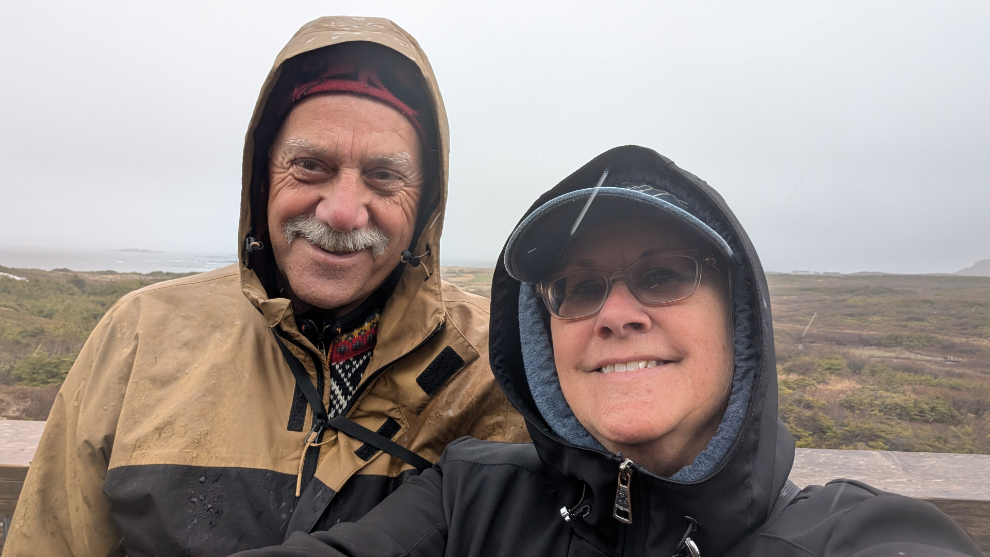 Murray Lundberg and Cathy Dyson in a cold rain at L'Anse aux Meadows National Historic Site, Newfoundland.