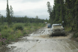 Driving through puddles and mud in the Whitehorse Copper Belt. 