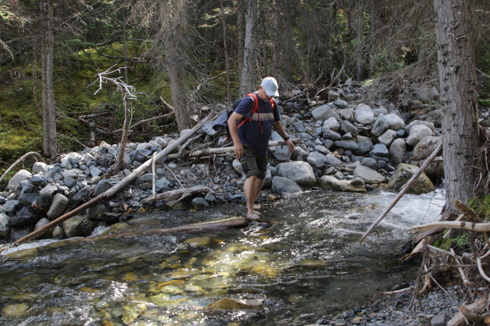 Barefoot creek crossing on 'Middle Ridge' above Tutshi Lake, BC.
