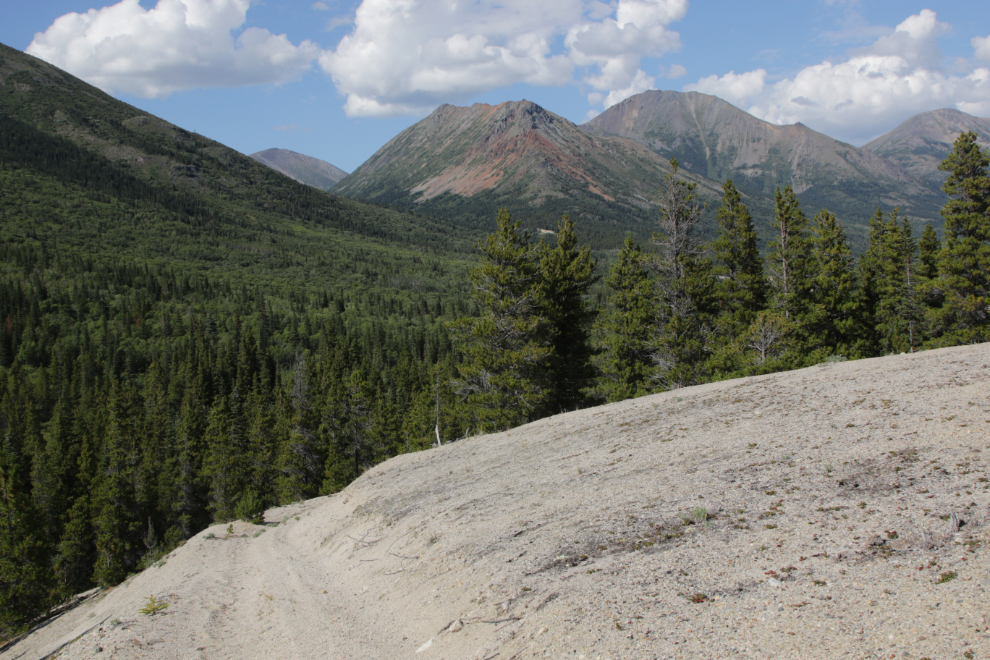 An ATV mining exploration trail crosses a large esker of decomposed granite above Tutshi Lake BC.